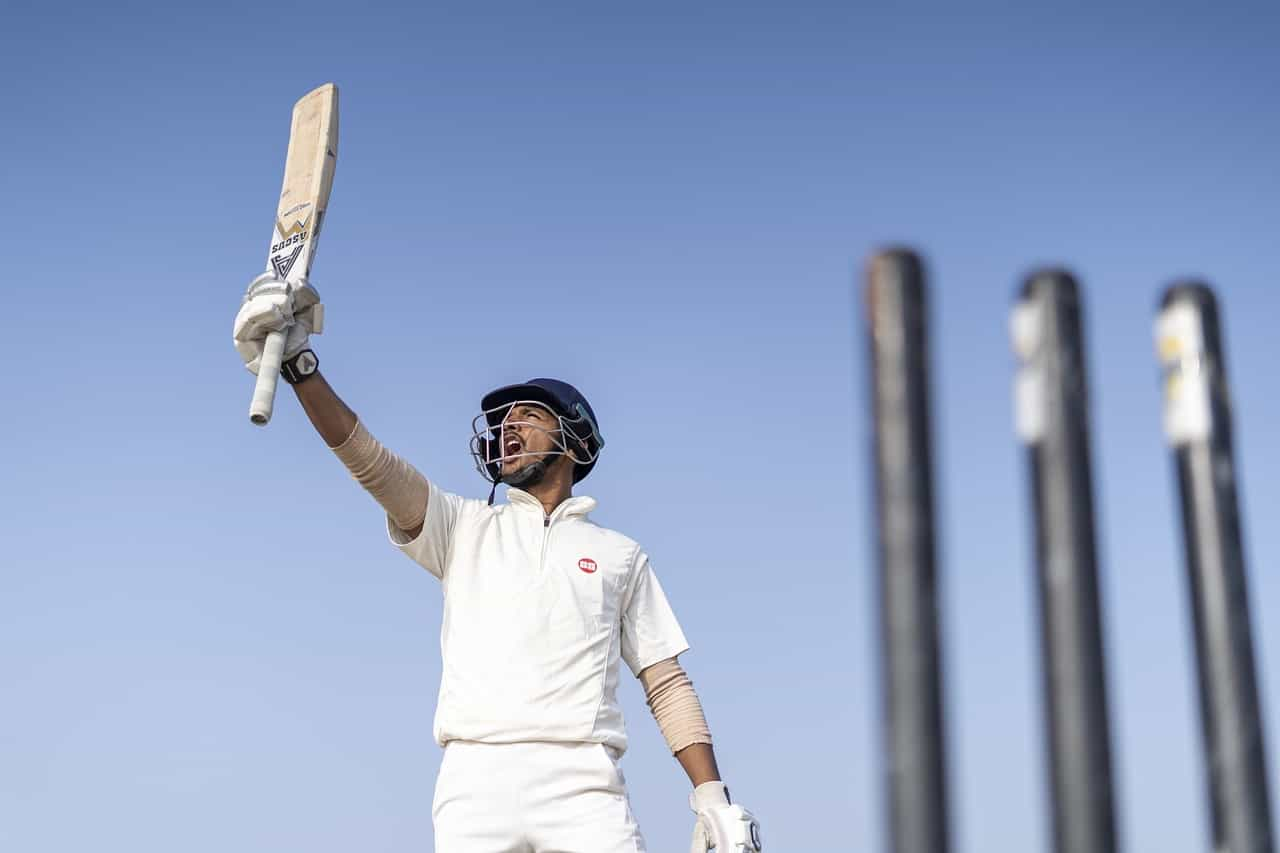 Cricket player celebrating.